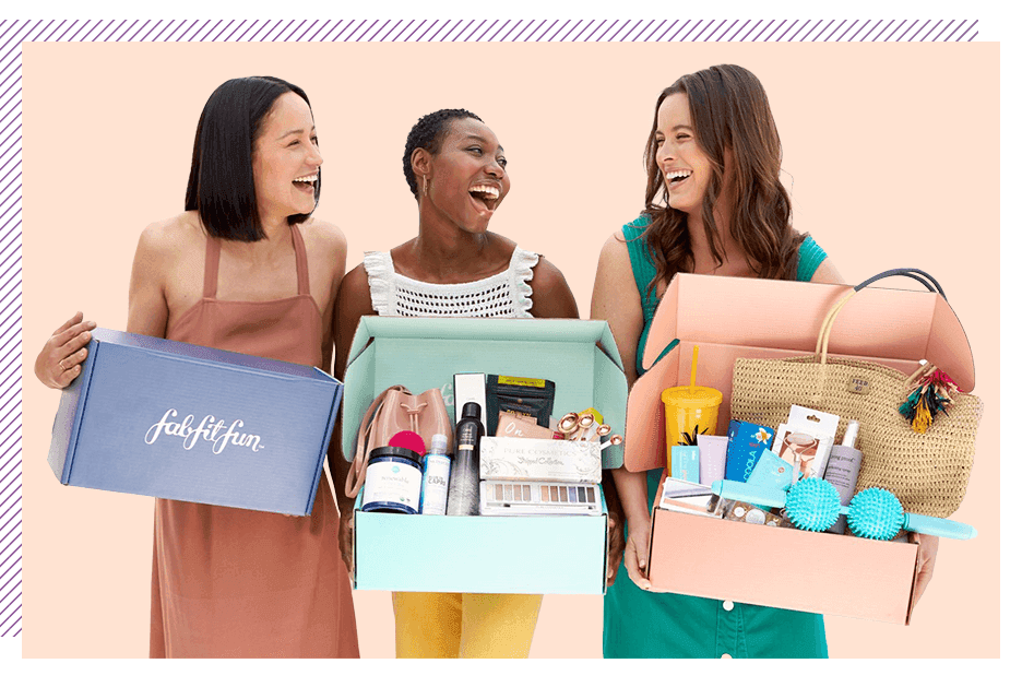 Women showing their FabFitFun boxes